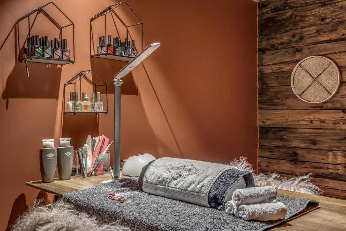 Un ou plusieurs lits dans un hébergement de l'établissement Hotel & Spa Le Val d'Isère