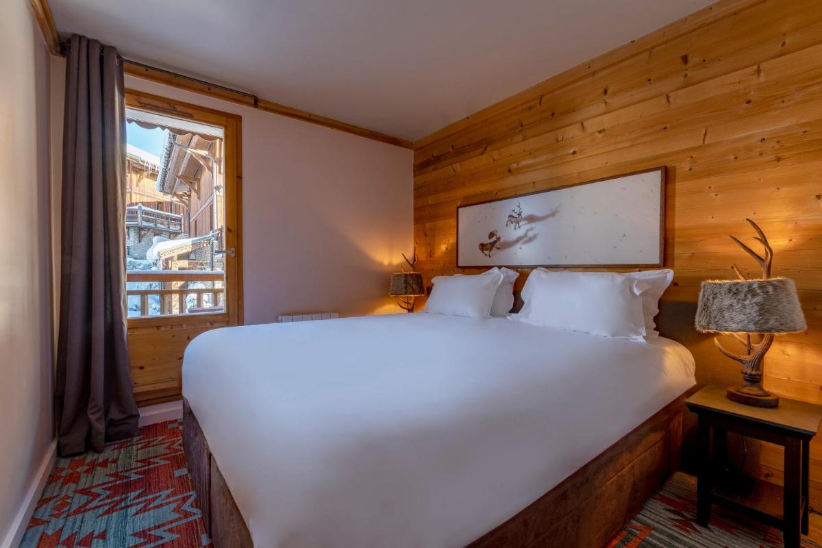 Un ou plusieurs lits dans un hébergement de l'établissement Chalet Hotel Kaya