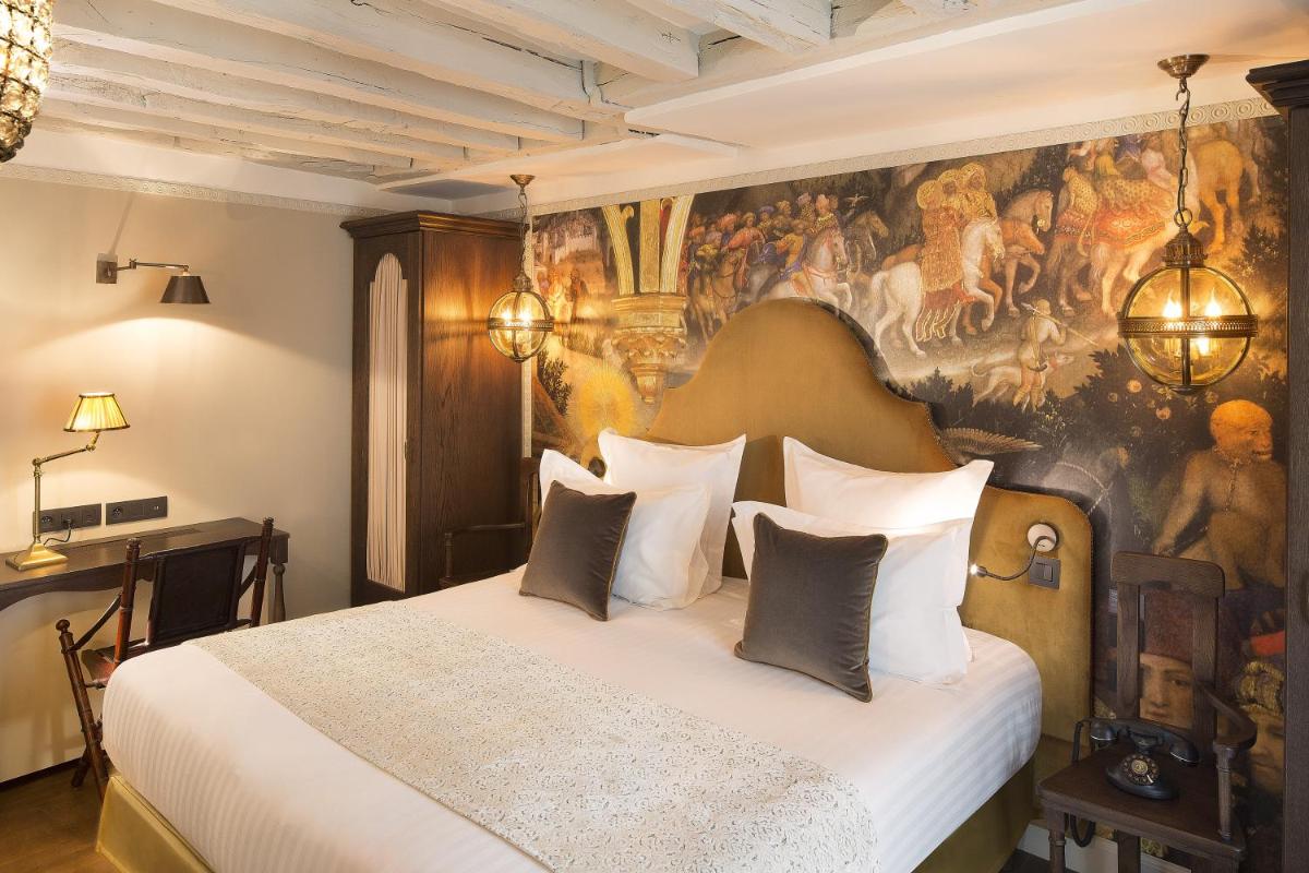 Un ou plusieurs lits dans un hébergement de l'établissement Hôtel Da Vinci & Spa