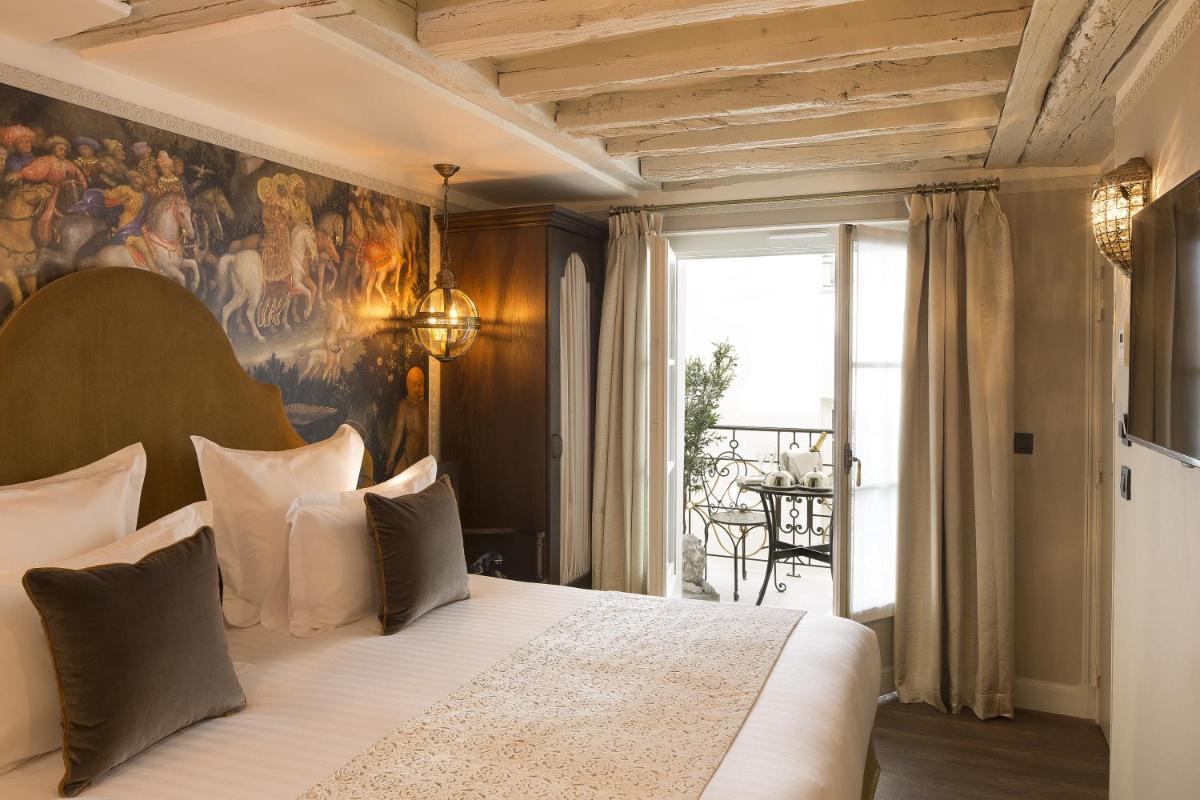 Un ou plusieurs lits dans un hébergement de l'établissement Hôtel Da Vinci & Spa