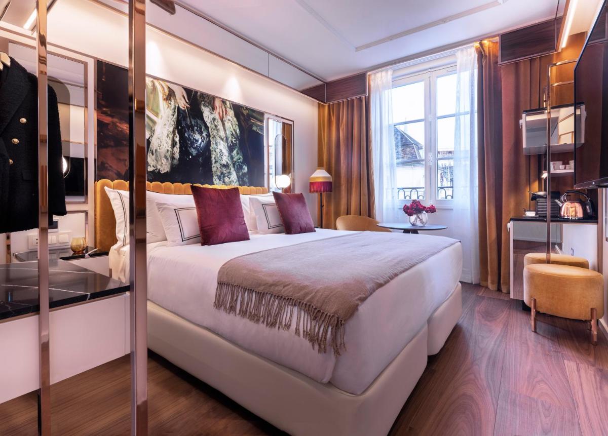 Un ou plusieurs lits dans un hébergement de l'établissement Maison Colbert Member of Meliá Collection Notre-Dame