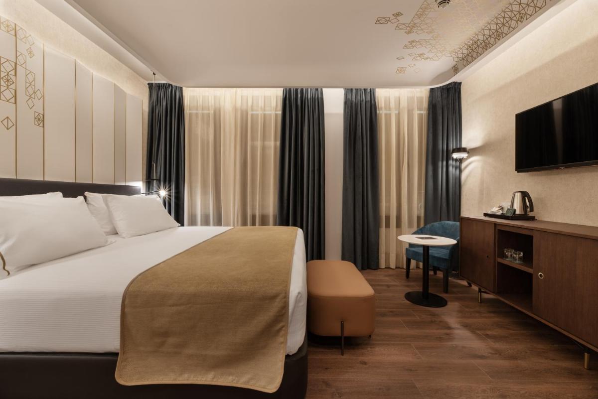 Cama o camas de una habitación en Áurea Palacio de Correos by Eurostars Hotel Company