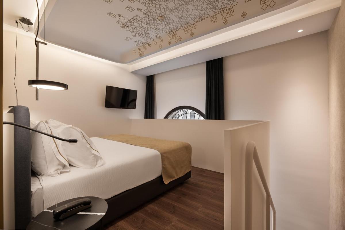 Cama o camas de una habitación en Áurea Palacio de Correos by Eurostars Hotel Company