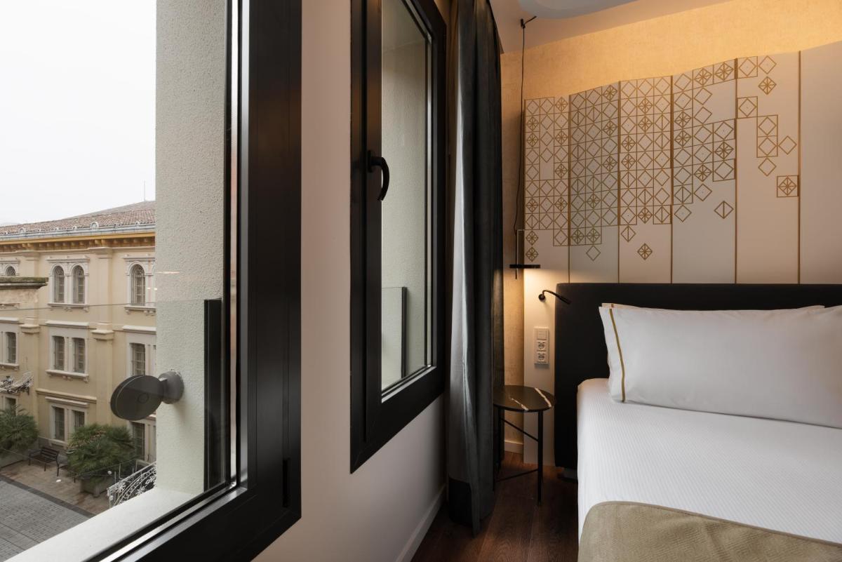 Cama o camas de una habitación en Áurea Palacio de Correos by Eurostars Hotel Company