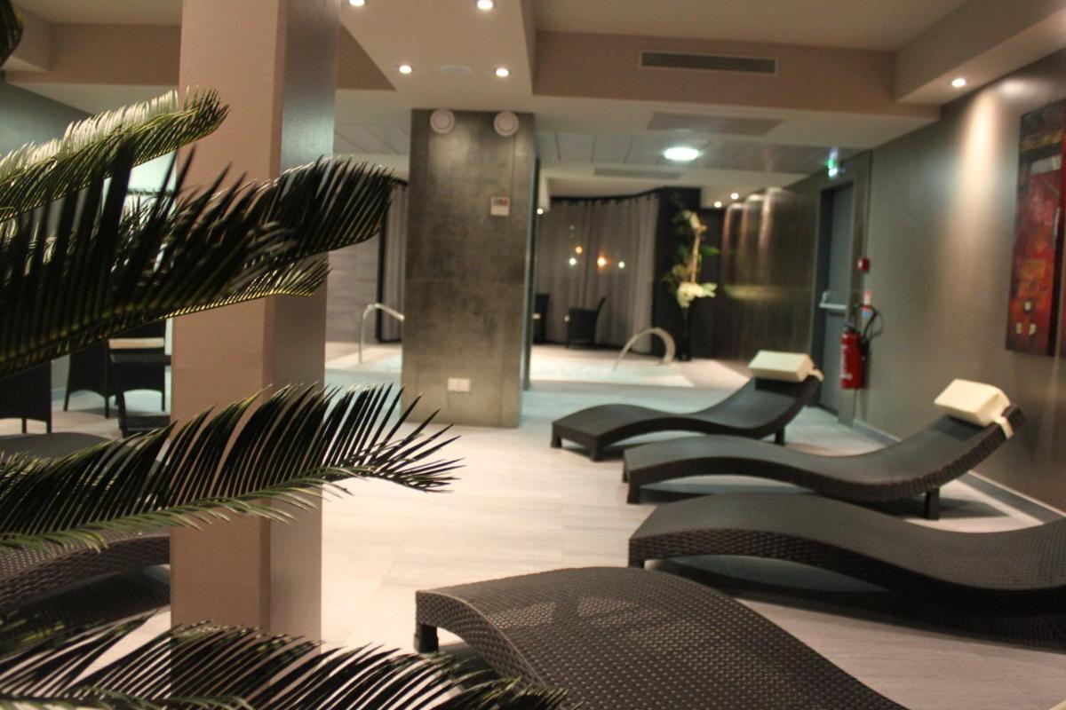 Coin salon dans l'établissement Hotel Palladia