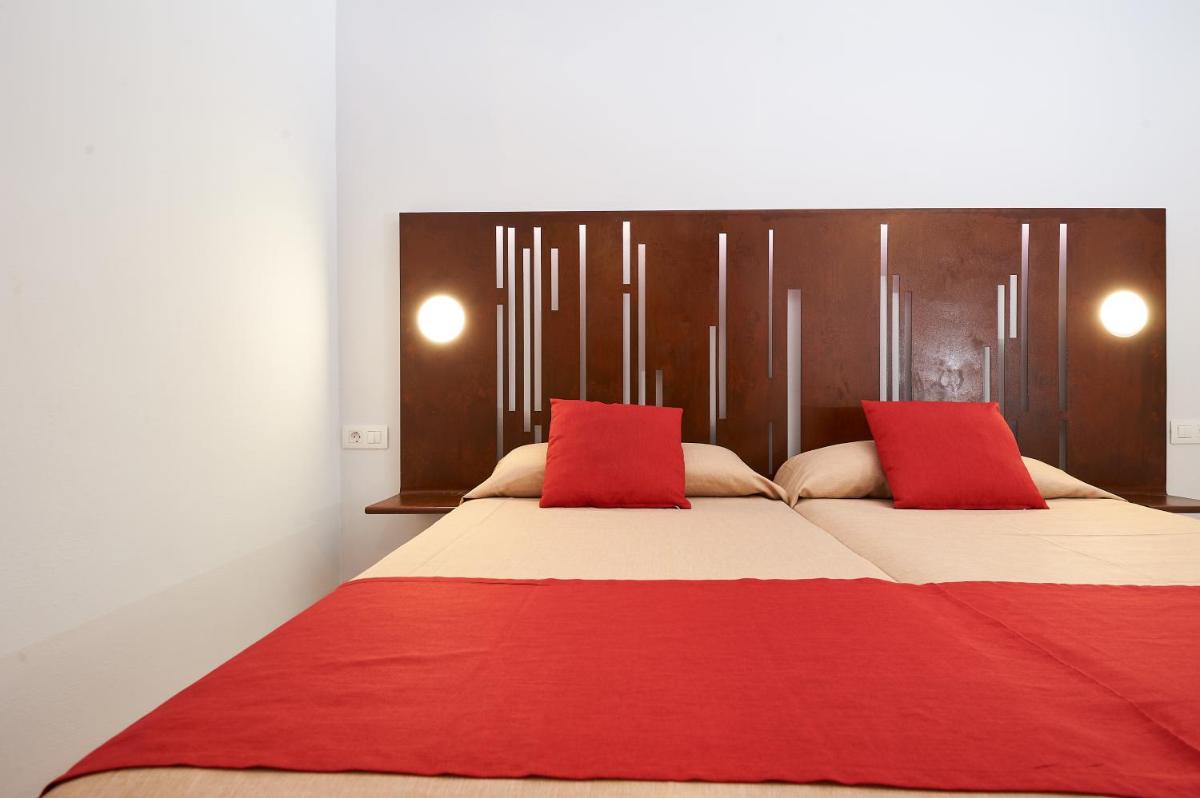 Cama o camas de una habitación en Kn Aparthotel Columbus