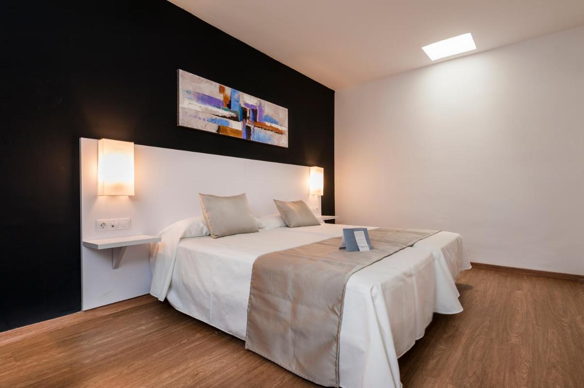 Cama o camas de una habitación en Kn Aparthotel Columbus