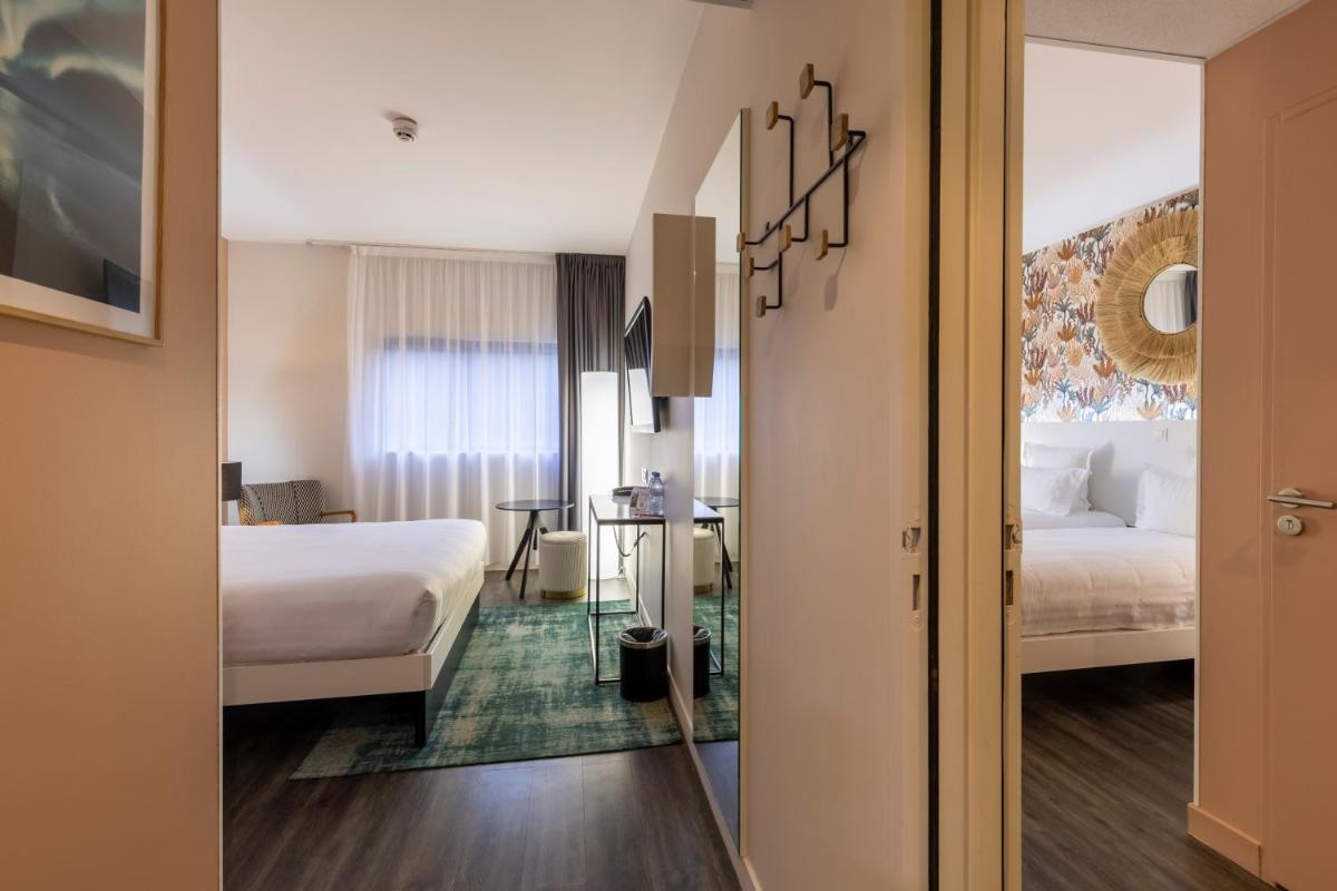 Un ou plusieurs lits dans un hébergement de l'établissement PADJA Hôtel & Spa Vannes