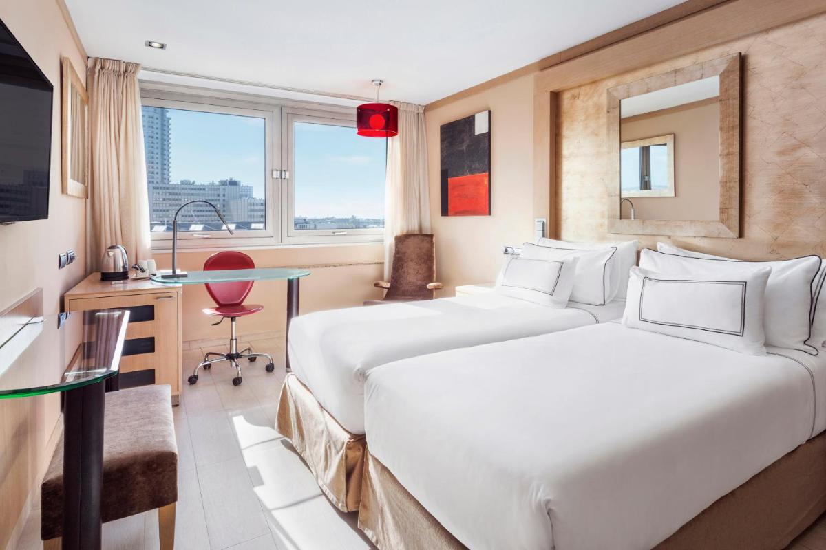 Cama o camas de una habitación en Melia Madrid Princesa