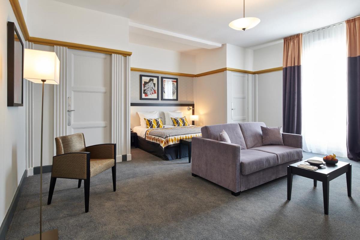 Coin salon dans l'établissement Hotel & Spa Vacances Bleues Le Splendid