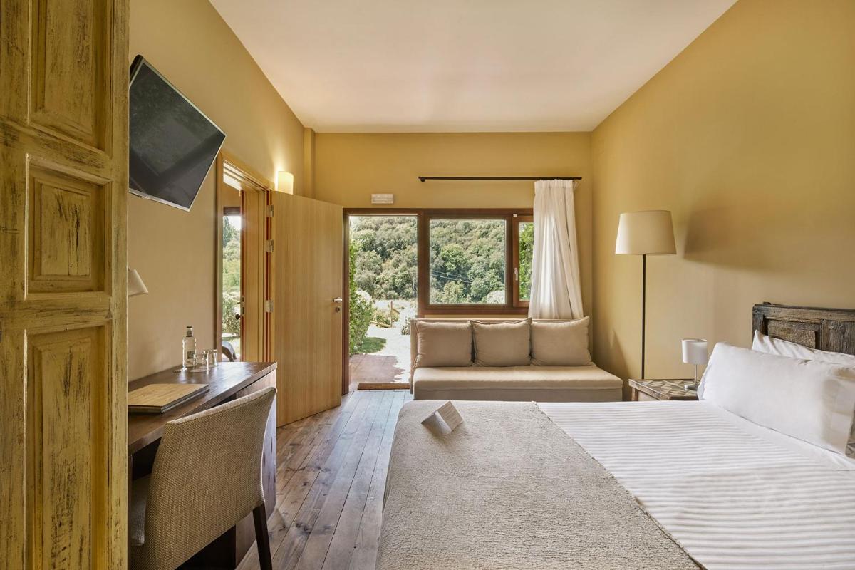 Cama o camas de una habitación en Mas Salagros EcoResort & SPA