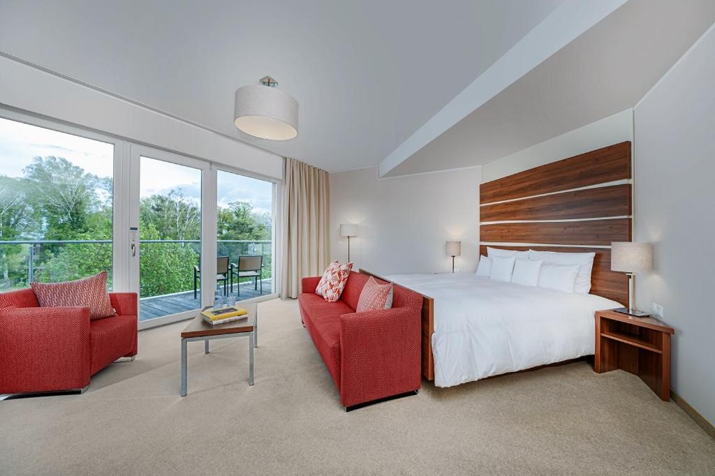 Ein Bett oder Betten in einem Zimmer der Unterkunft THE GRAND Ahrenshoop