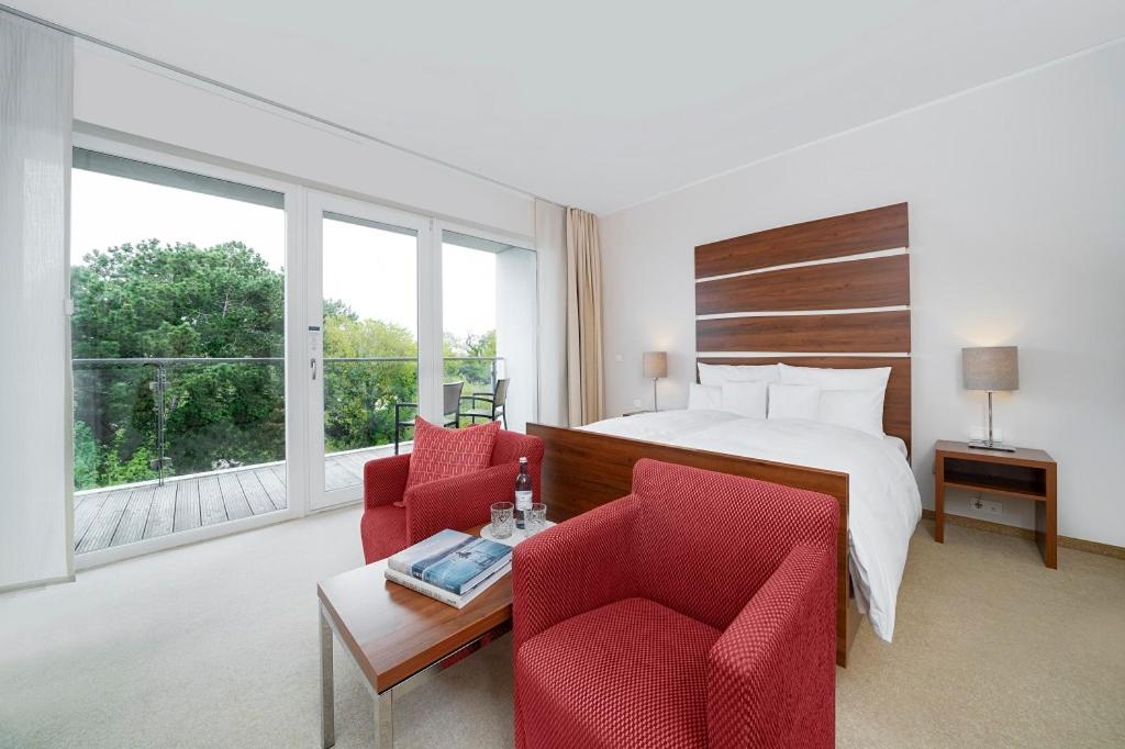Ein Bett oder Betten in einem Zimmer der Unterkunft THE GRAND Ahrenshoop