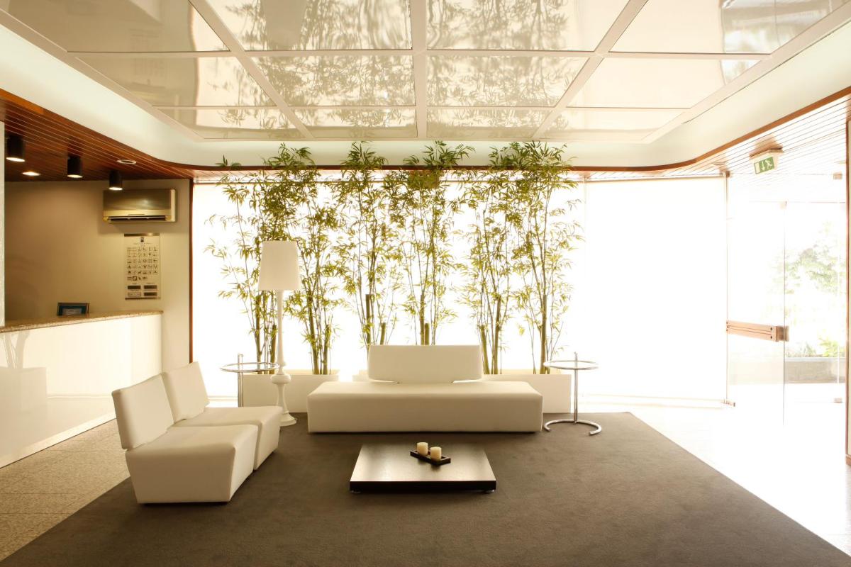 Uma área de estar em Hotel Costa de Prata 2 & Spa