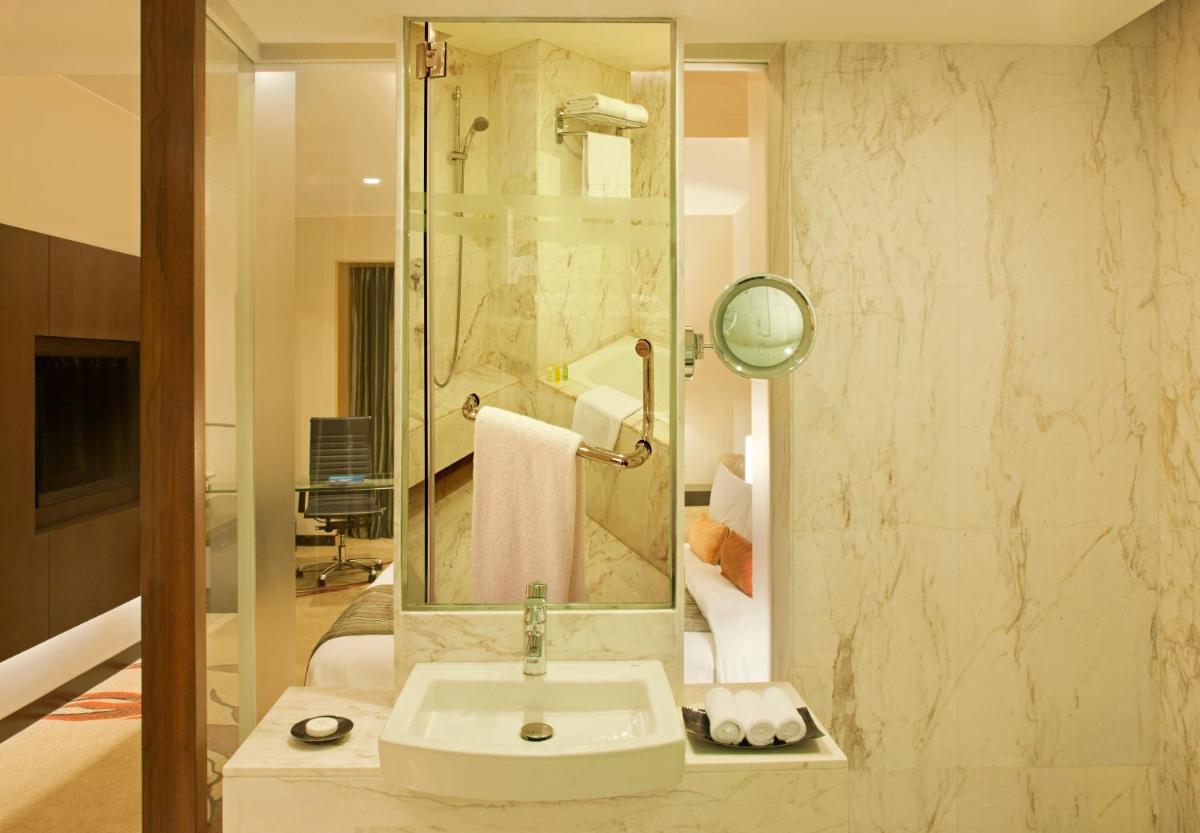 a bathroom with a sink and a shower at Radisson Blu Hotel Amritsar in Amritsar