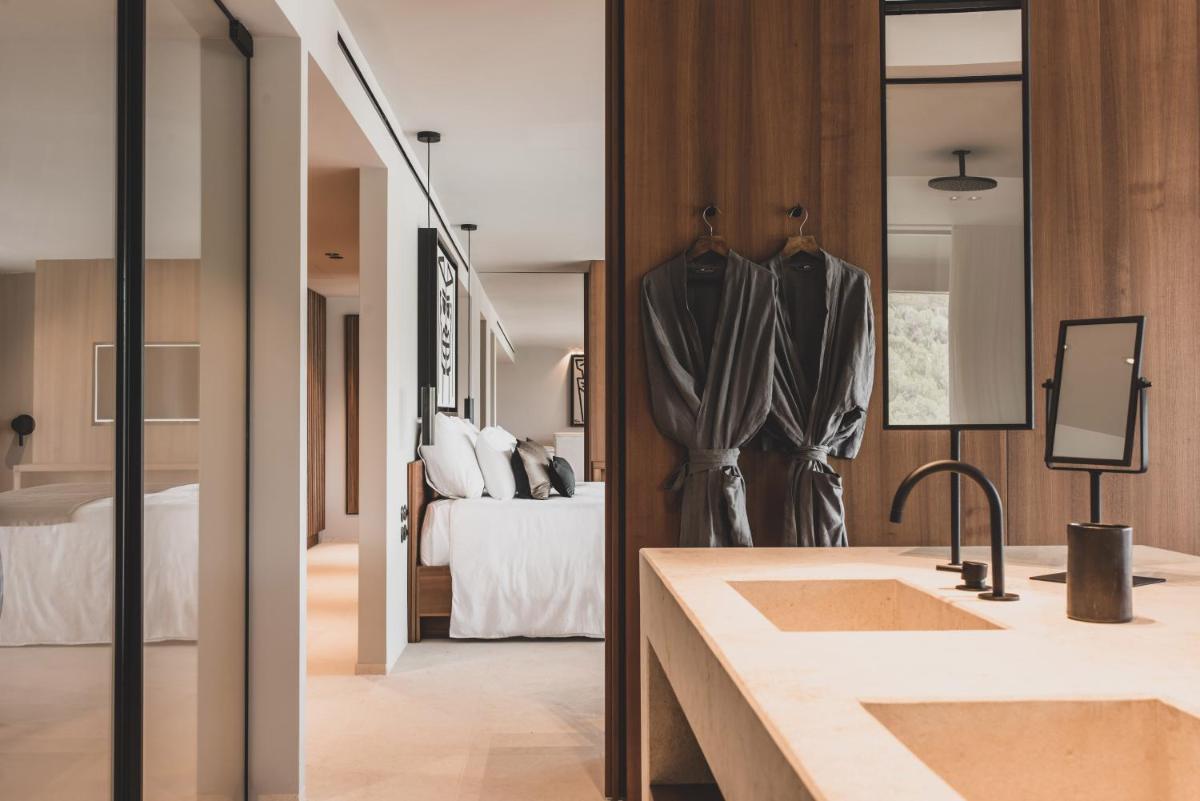 Cama o camas de una habitación en OKU Ibiza