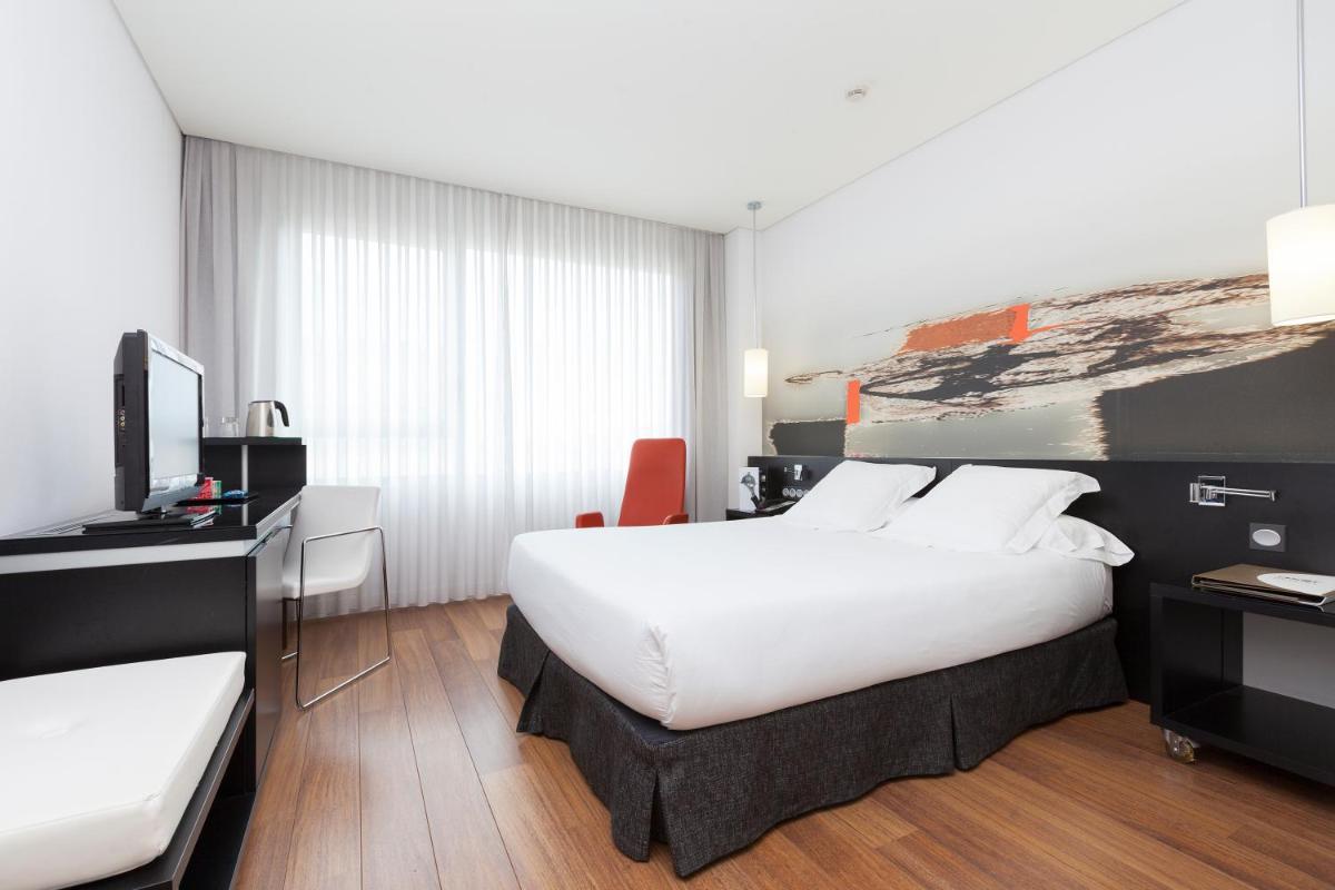 Cama o camas de una habitación en Axor Barajas