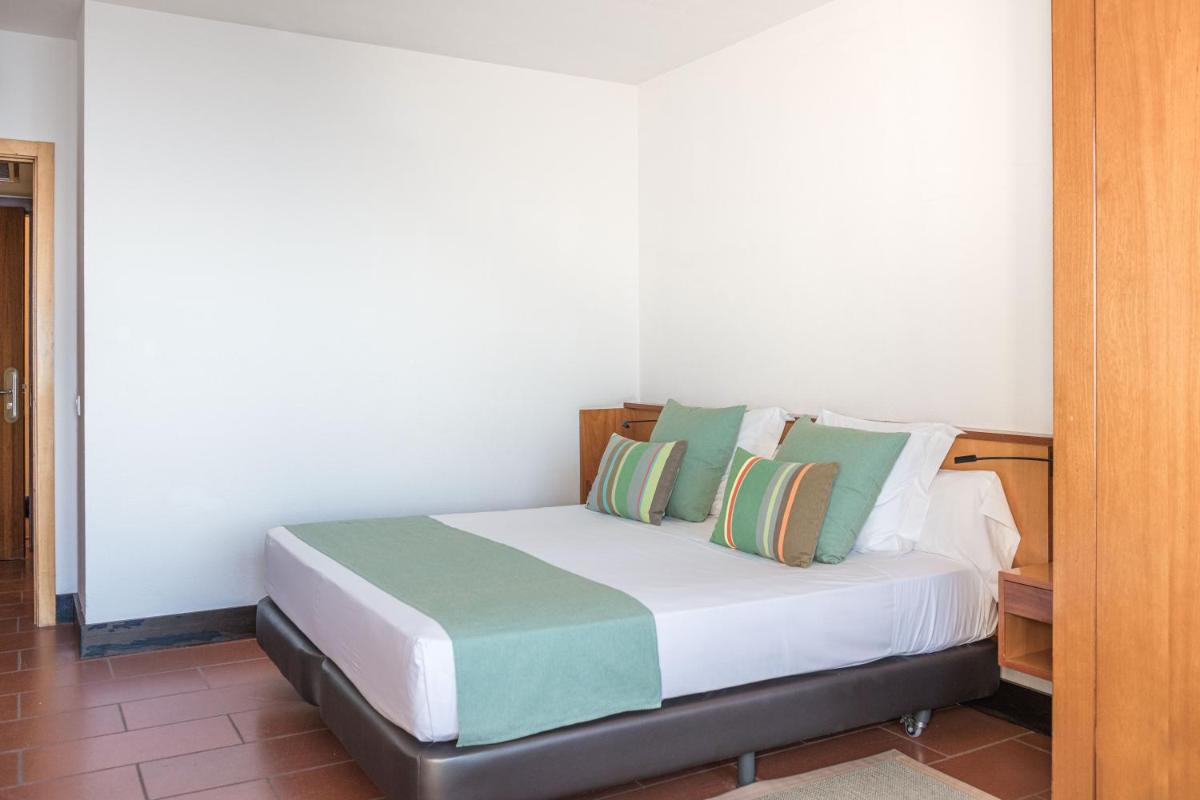 Cama o camas de una habitación en Almadraba Park Hotel