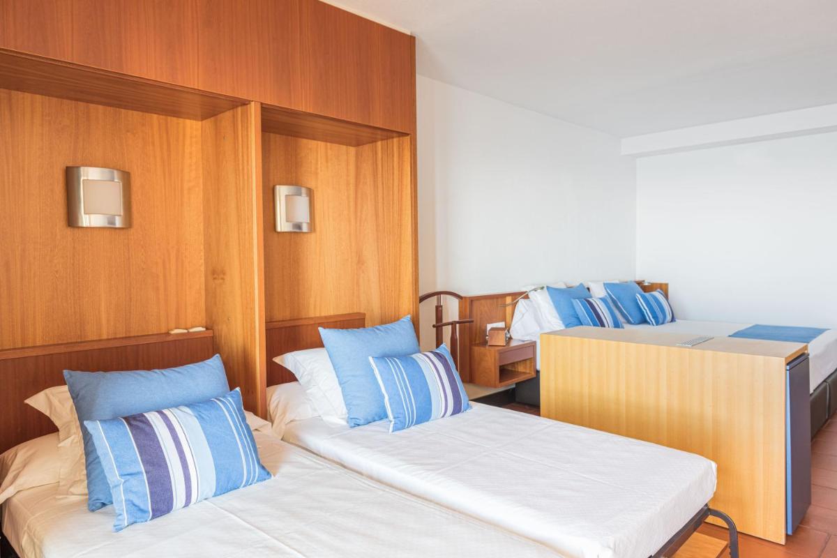 Cama o camas de una habitación en Almadraba Park Hotel