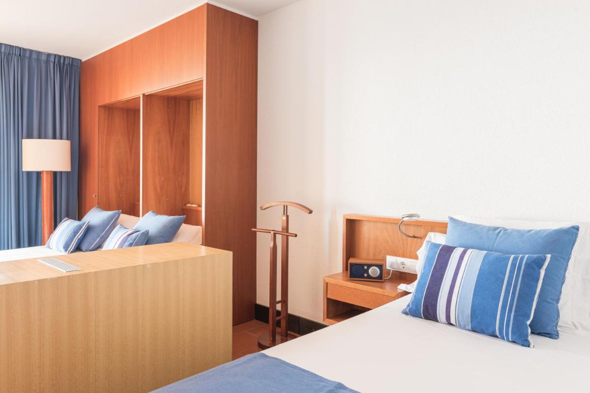 Cama o camas de una habitación en Almadraba Park Hotel