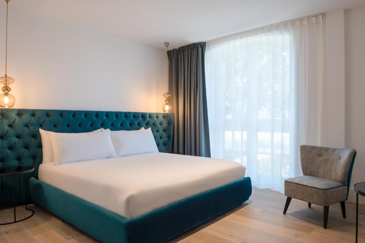 Un ou plusieurs lits dans un hébergement de l'établissement Hôtel Ginkgo - SPA Biloba