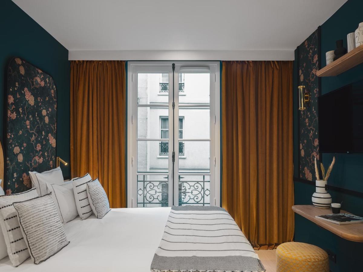 Un ou plusieurs lits dans un hébergement de l'établissement Dandy Hotel
