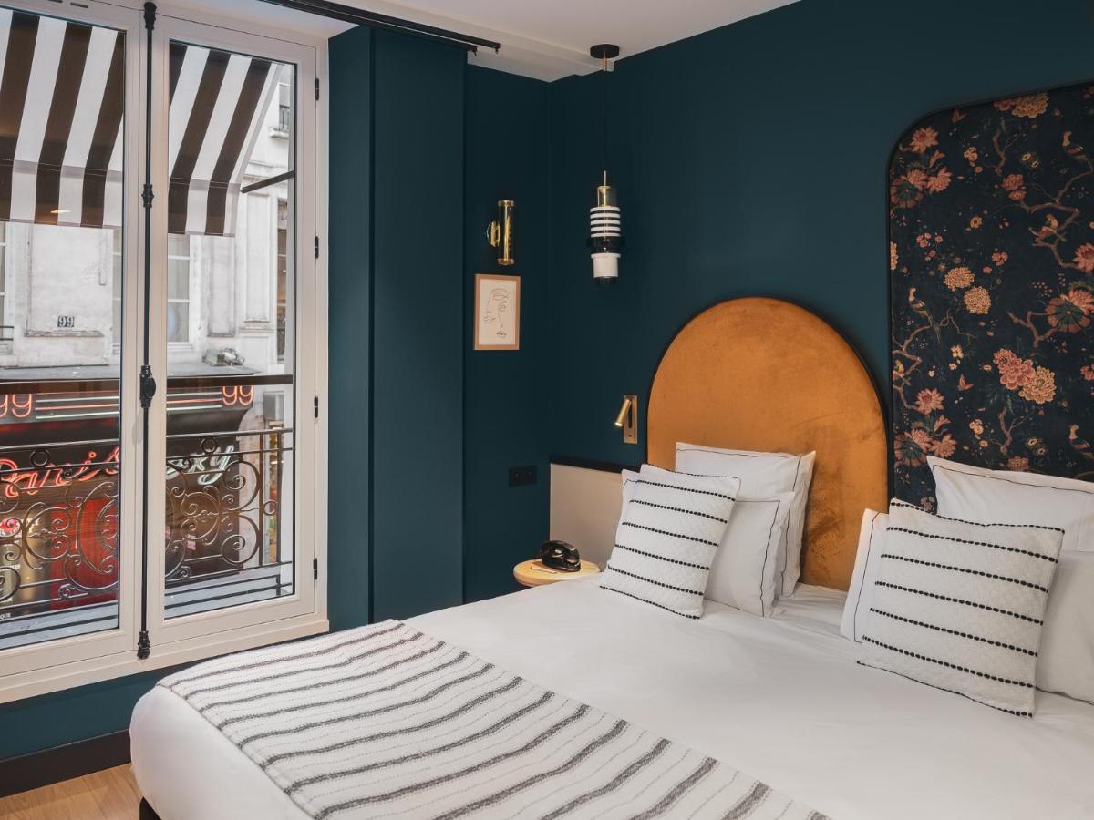 Un ou plusieurs lits dans un hébergement de l'établissement Dandy Hotel