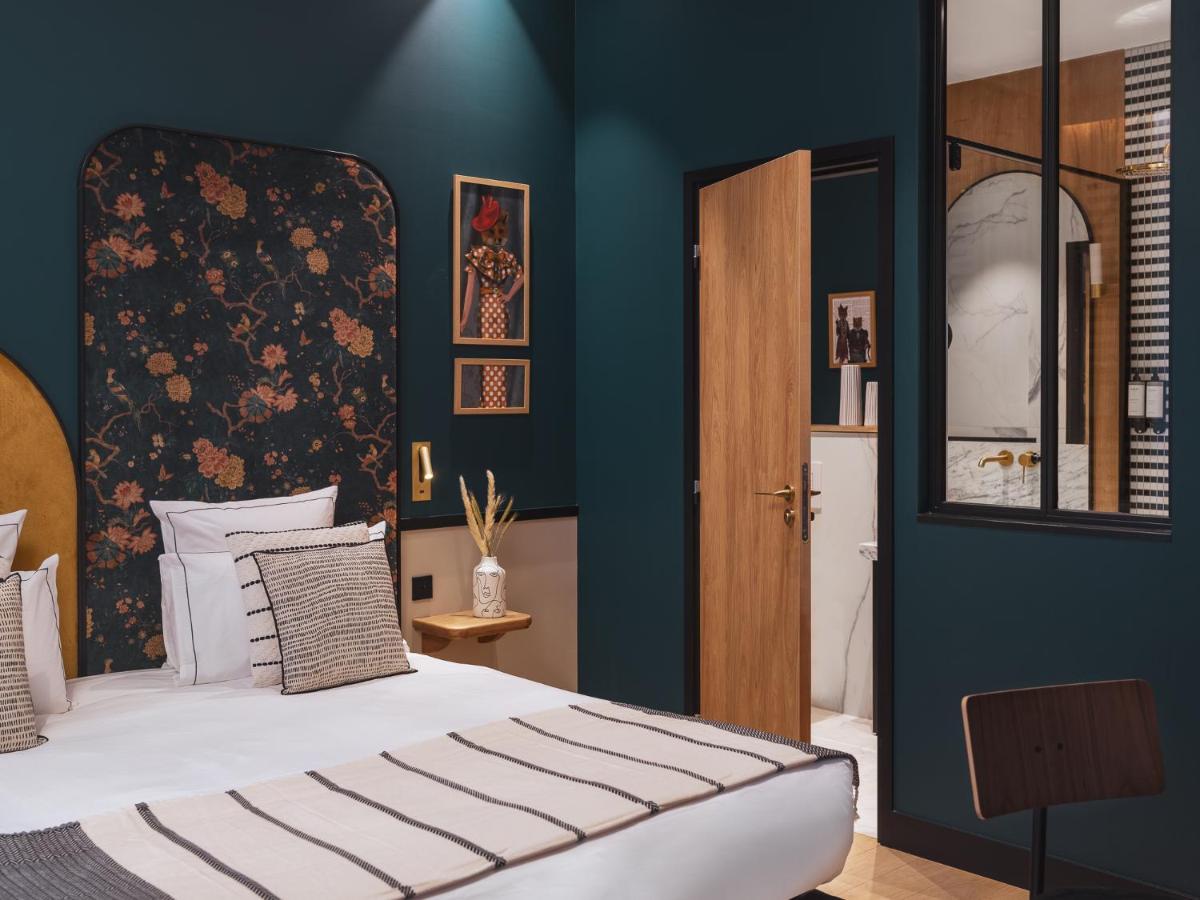 Un ou plusieurs lits dans un hébergement de l'établissement Dandy Hotel