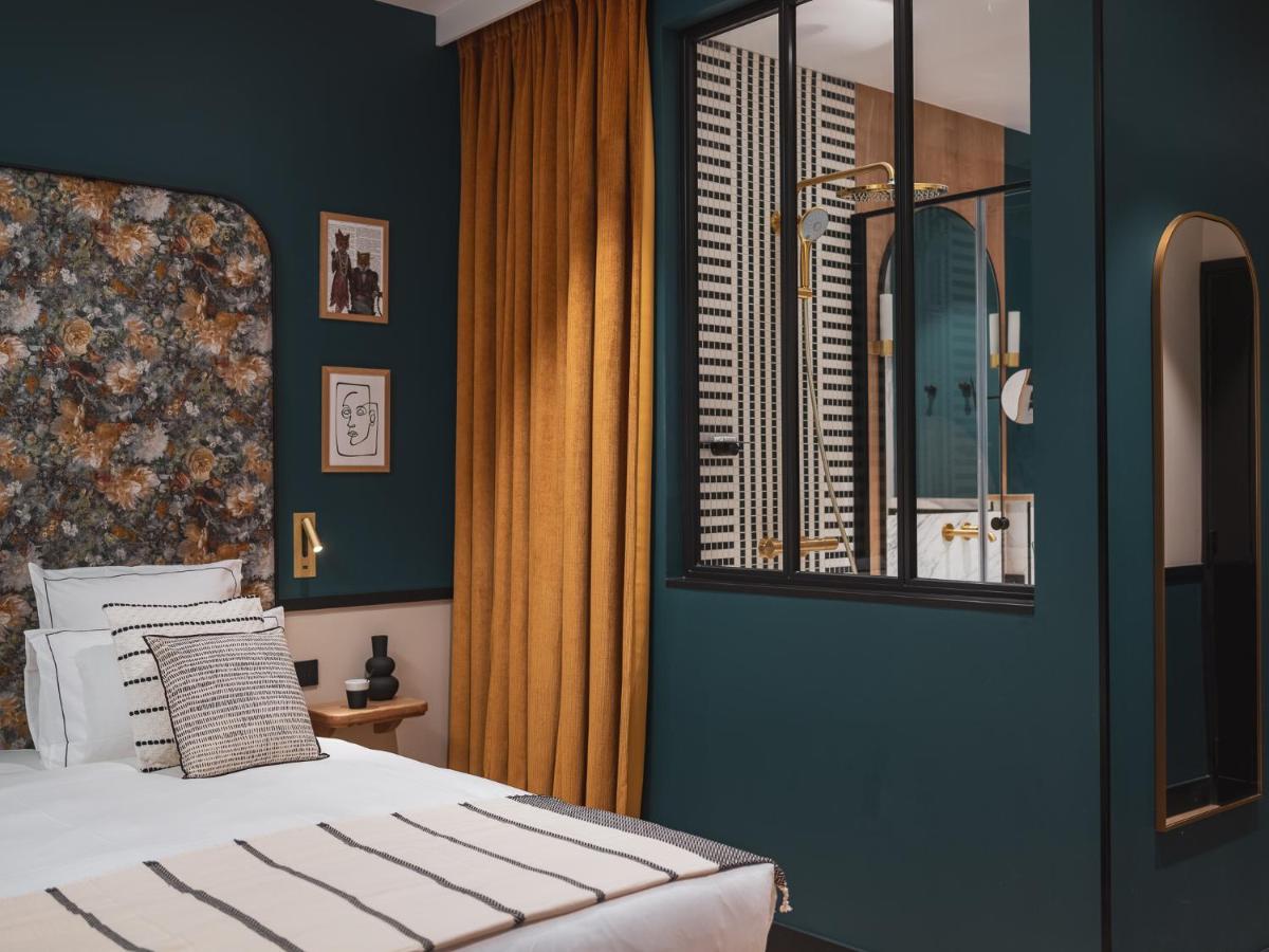 Un ou plusieurs lits dans un hébergement de l'établissement Dandy Hotel