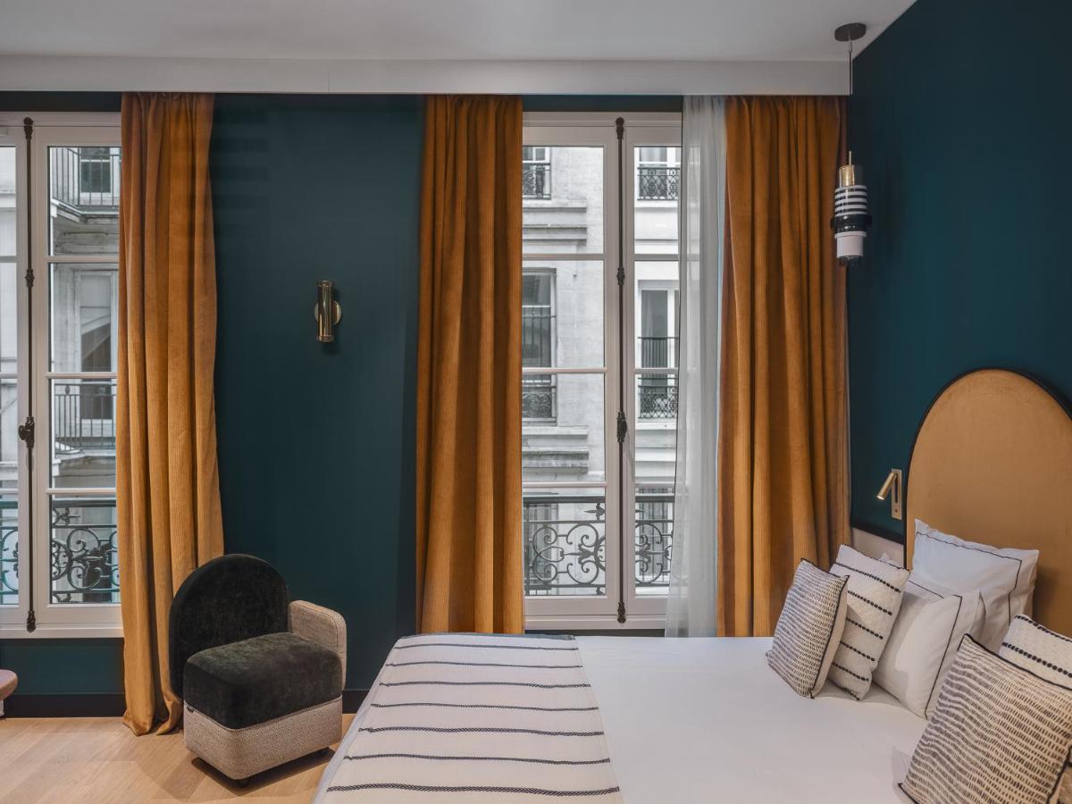 Un ou plusieurs lits dans un hébergement de l'établissement Dandy Hotel