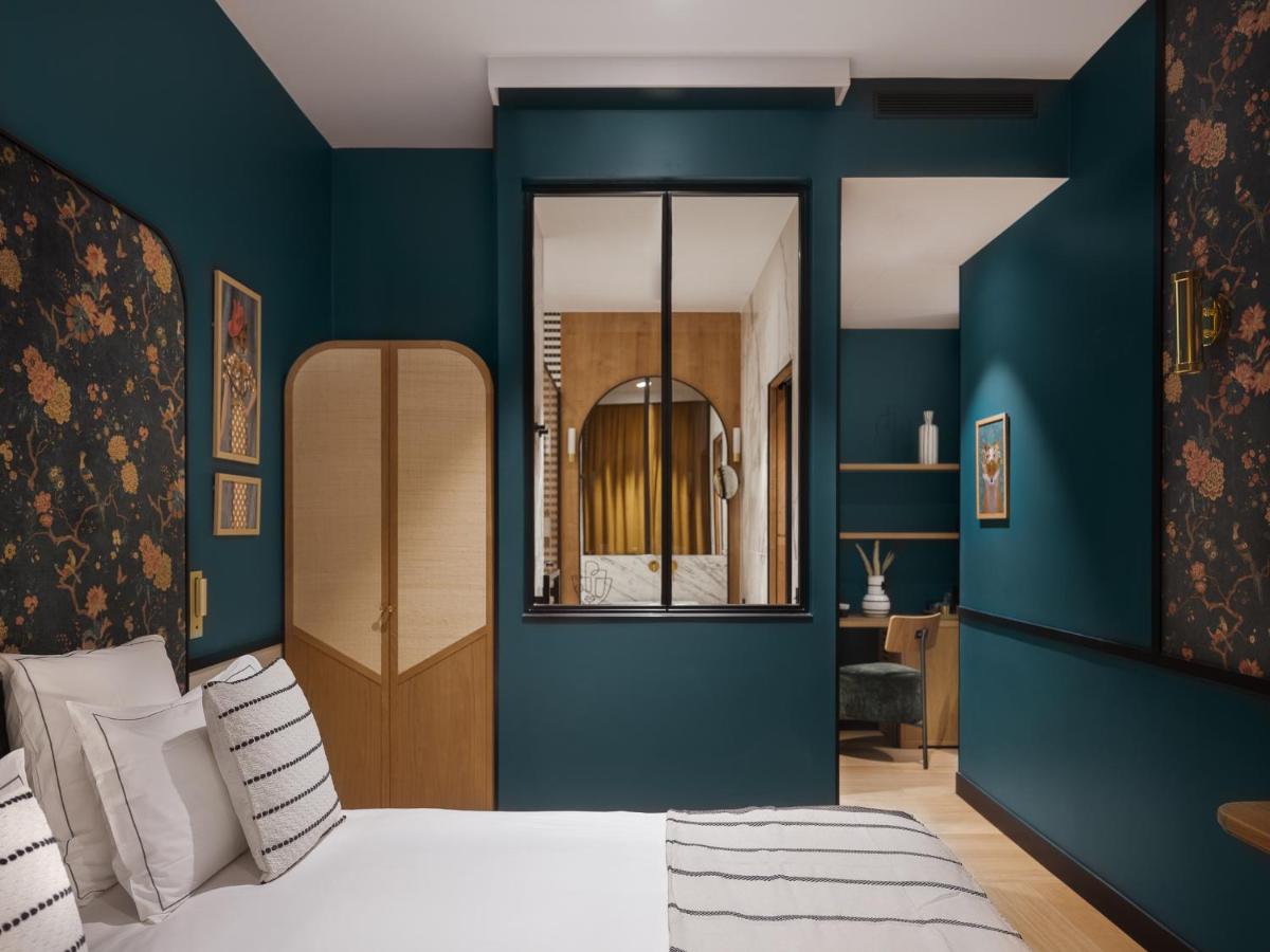 Un ou plusieurs lits dans un hébergement de l'établissement Dandy Hotel
