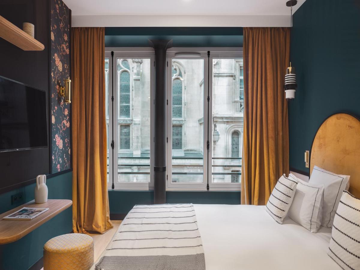 Un ou plusieurs lits dans un hébergement de l'établissement Dandy Hotel