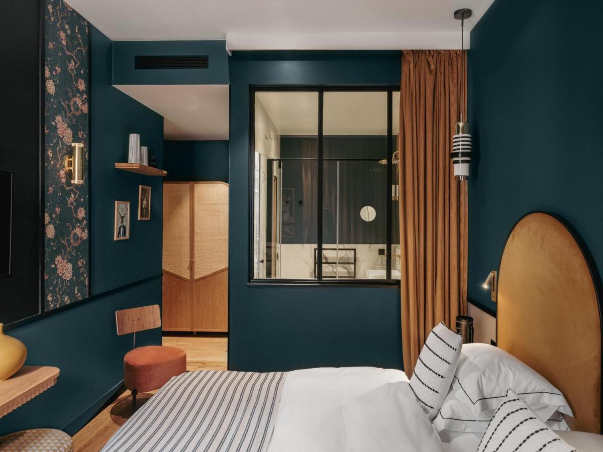 Un ou plusieurs lits dans un hébergement de l'établissement Dandy Hotel