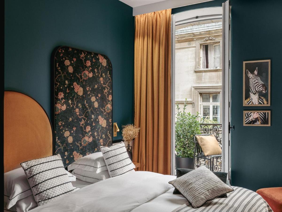 Un ou plusieurs lits dans un hébergement de l'établissement Dandy Hotel