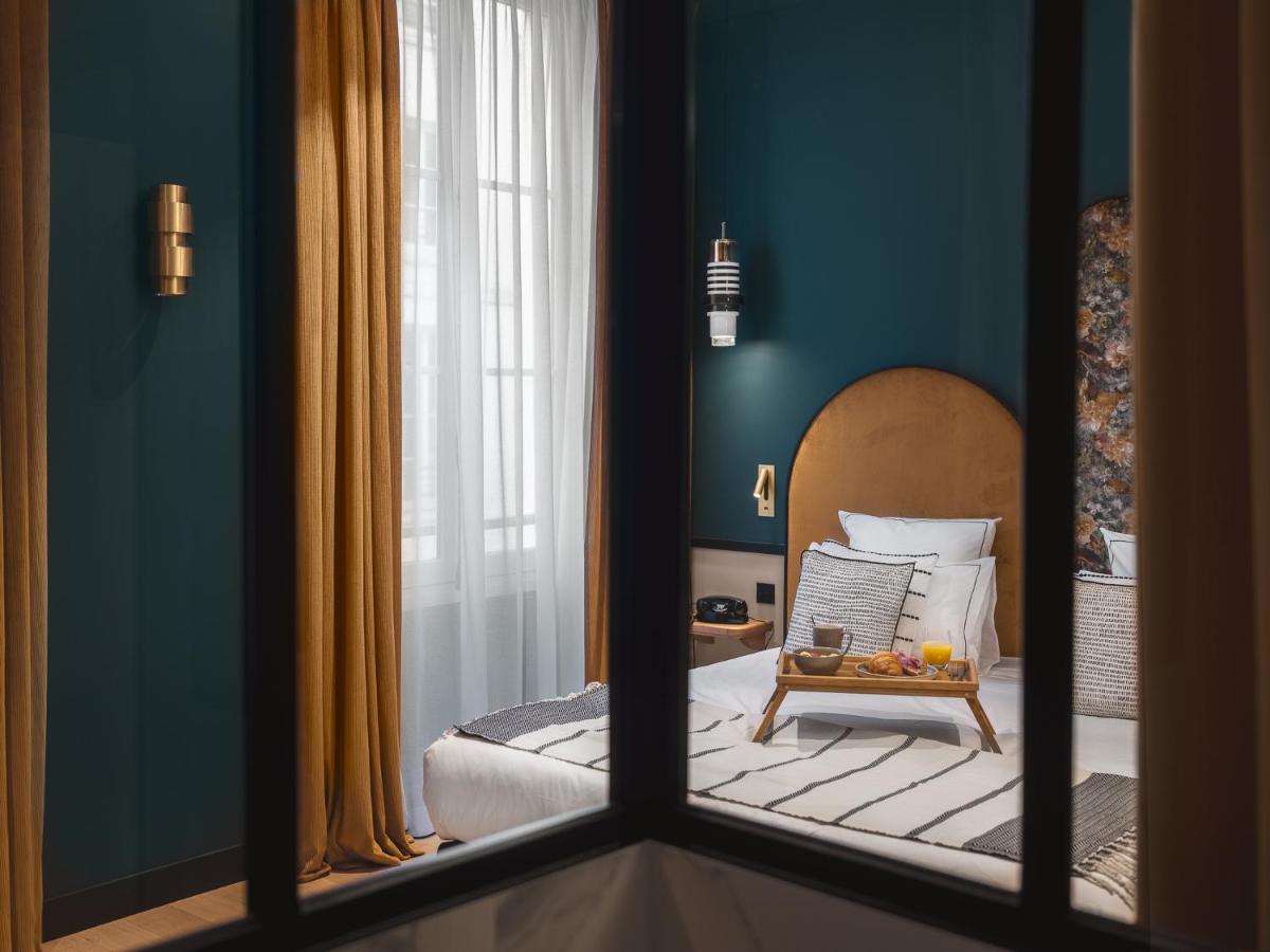 Un ou plusieurs lits dans un hébergement de l'établissement Dandy Hotel