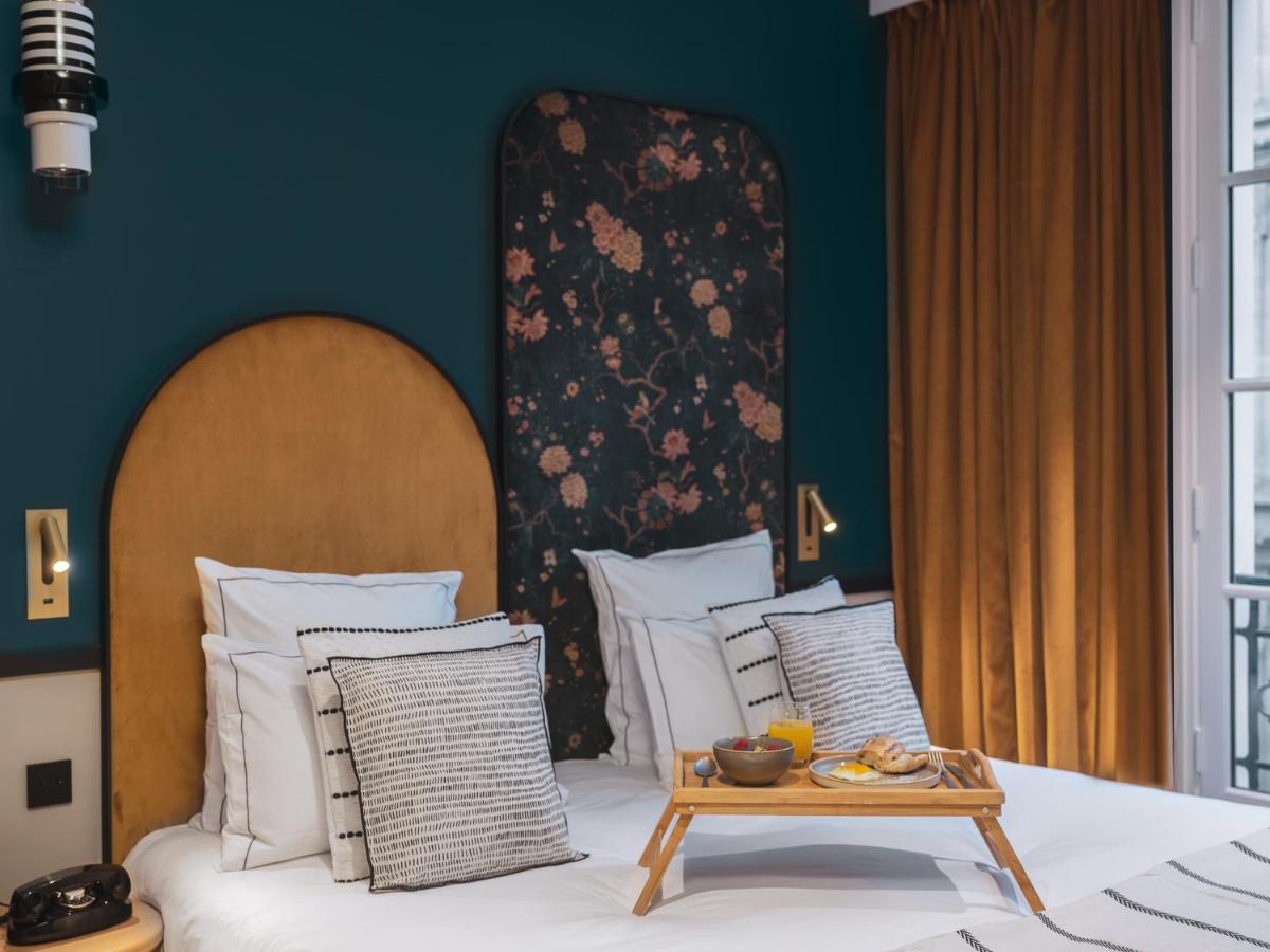 Un ou plusieurs lits dans un hébergement de l'établissement Dandy Hotel