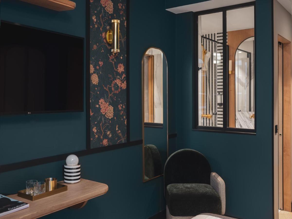 Télévision ou salle de divertissement dans l'établissement Dandy Hotel