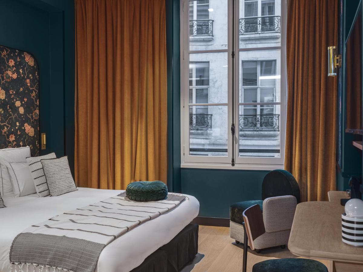 Un ou plusieurs lits dans un hébergement de l'établissement Dandy Hotel