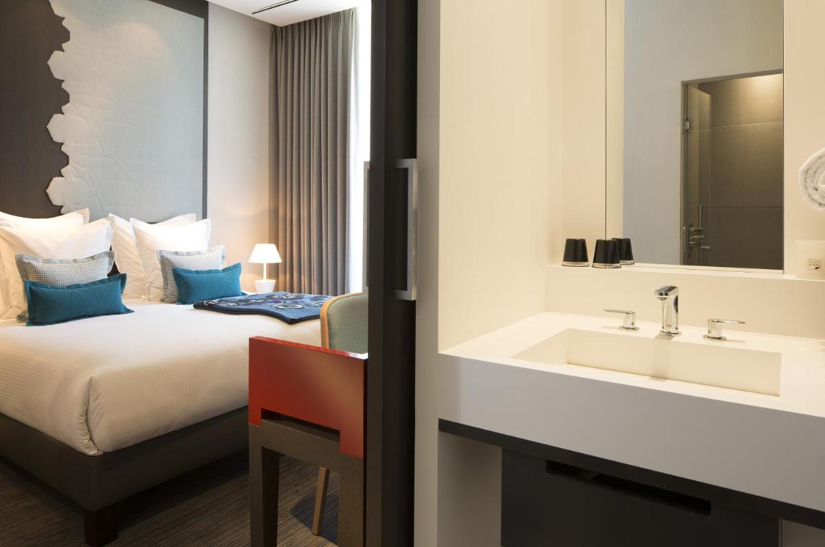 Un ou plusieurs lits dans un hébergement de l'établissement Hotel D - Strasbourg