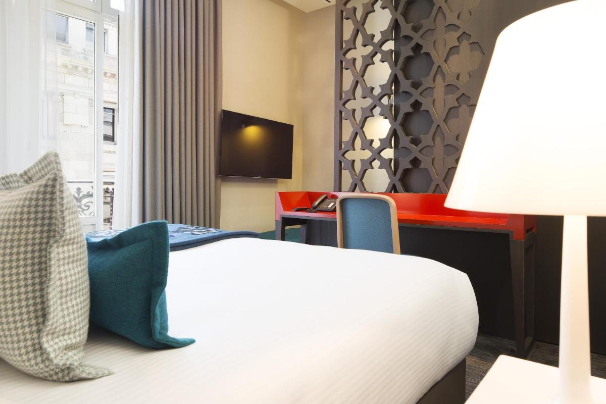 Télévision ou salle de divertissement dans l'établissement Hotel D - Strasbourg
