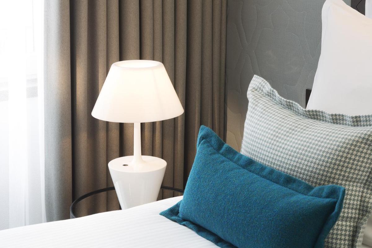 Un ou plusieurs lits dans un hébergement de l'établissement Hotel D - Strasbourg