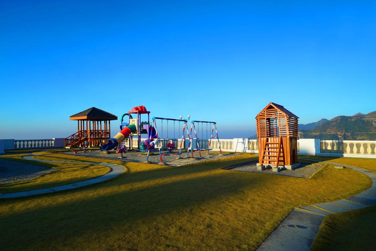 a park with a playground with a slide at Jaypee Residency Manor in Mussoorie