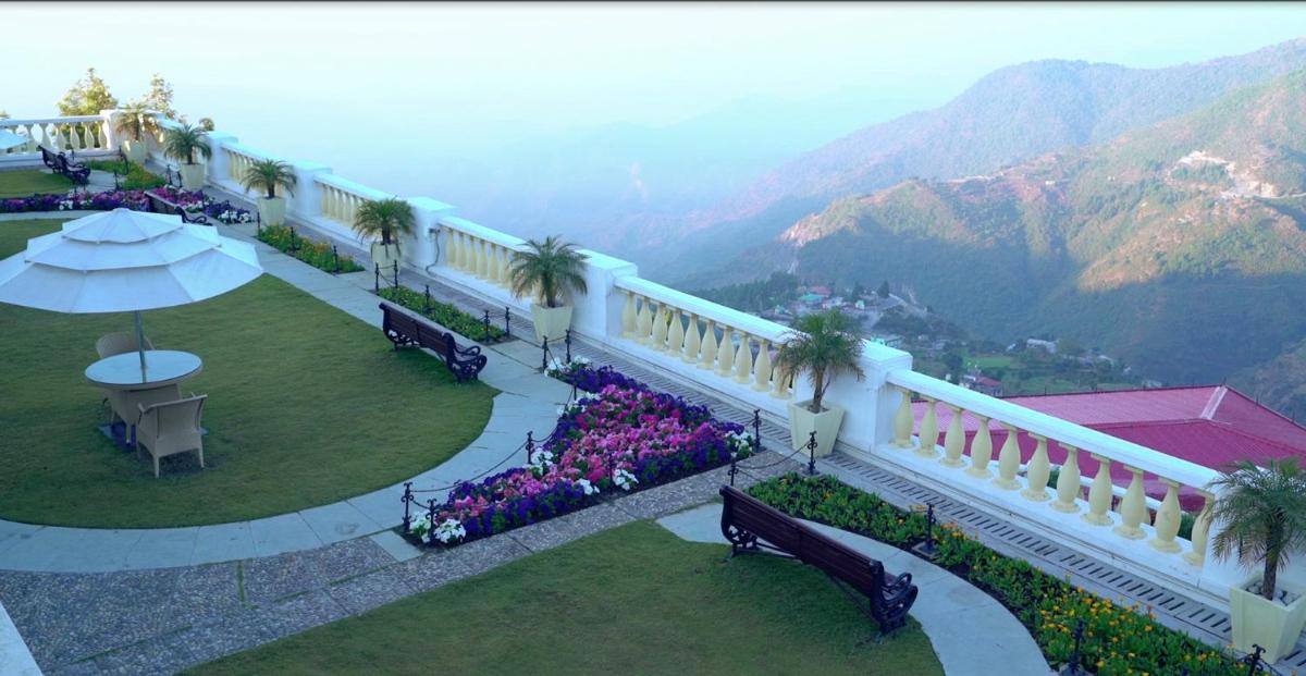 a balcony of a hotel with a view of the mountains at Jaypee Residency Manor in Mussoorie