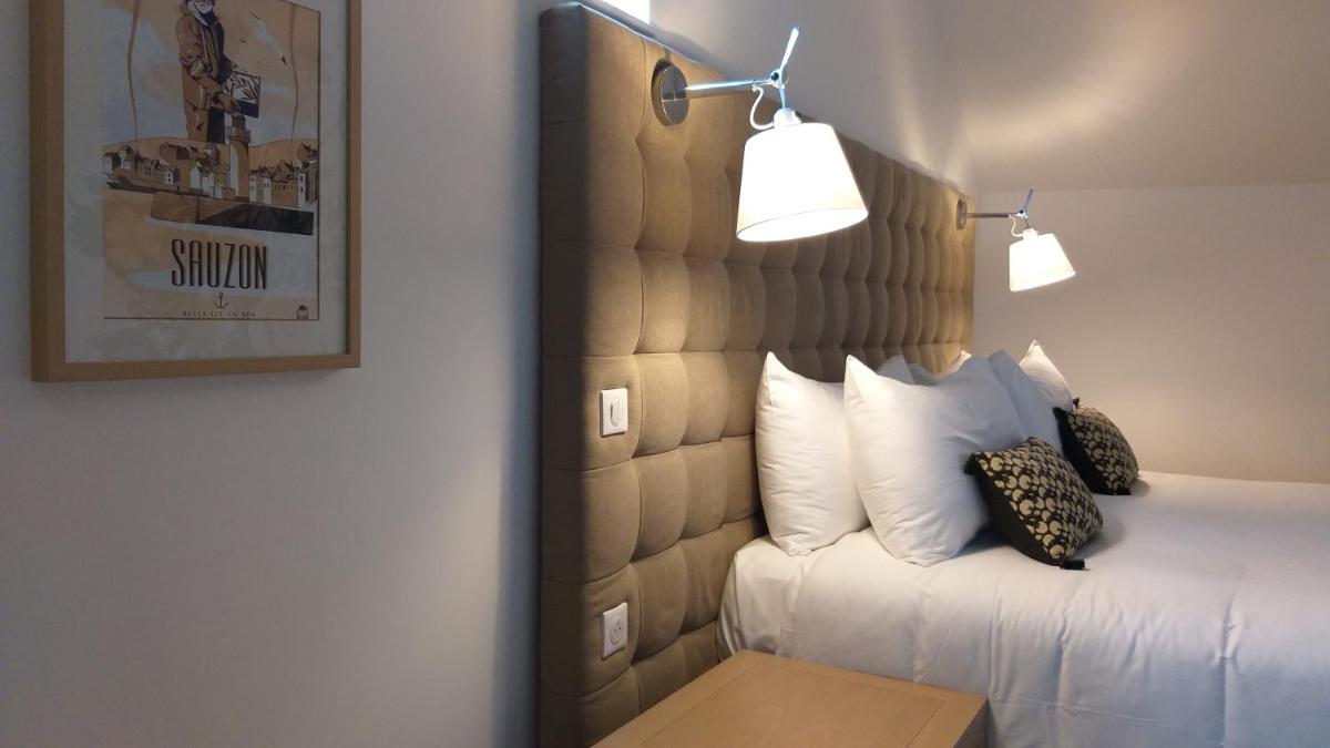 Un ou plusieurs lits dans un hébergement de l'établissement Hôtel Ginkgo - SPA Biloba
