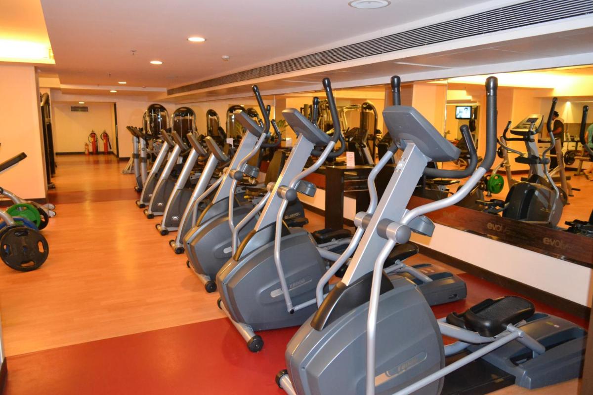a row of cardio machines in a gym at Sayaji Pune in Pune