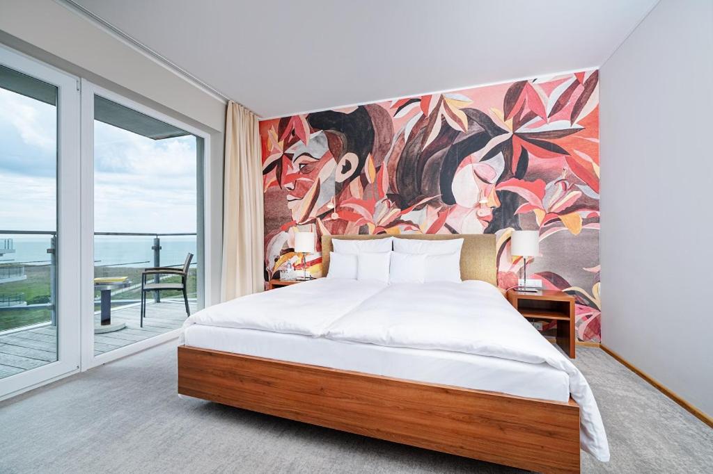 Ein Bett oder Betten in einem Zimmer der Unterkunft THE GRAND Ahrenshoop