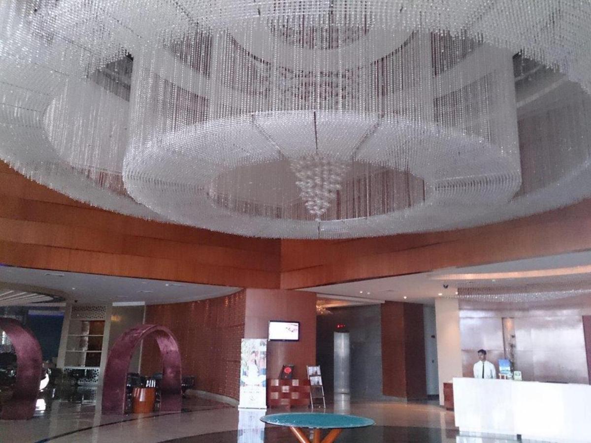 a large chandelier hanging from the ceiling of a building at Yashail Hotel Haridwar in Haridwār