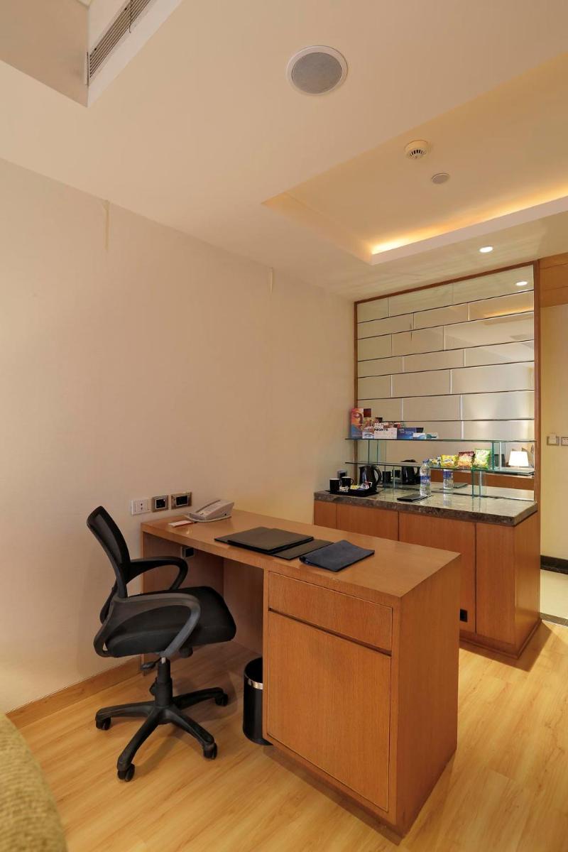 an office with a desk and a chair in a room at Yashail Hotel Haridwar in Haridwār