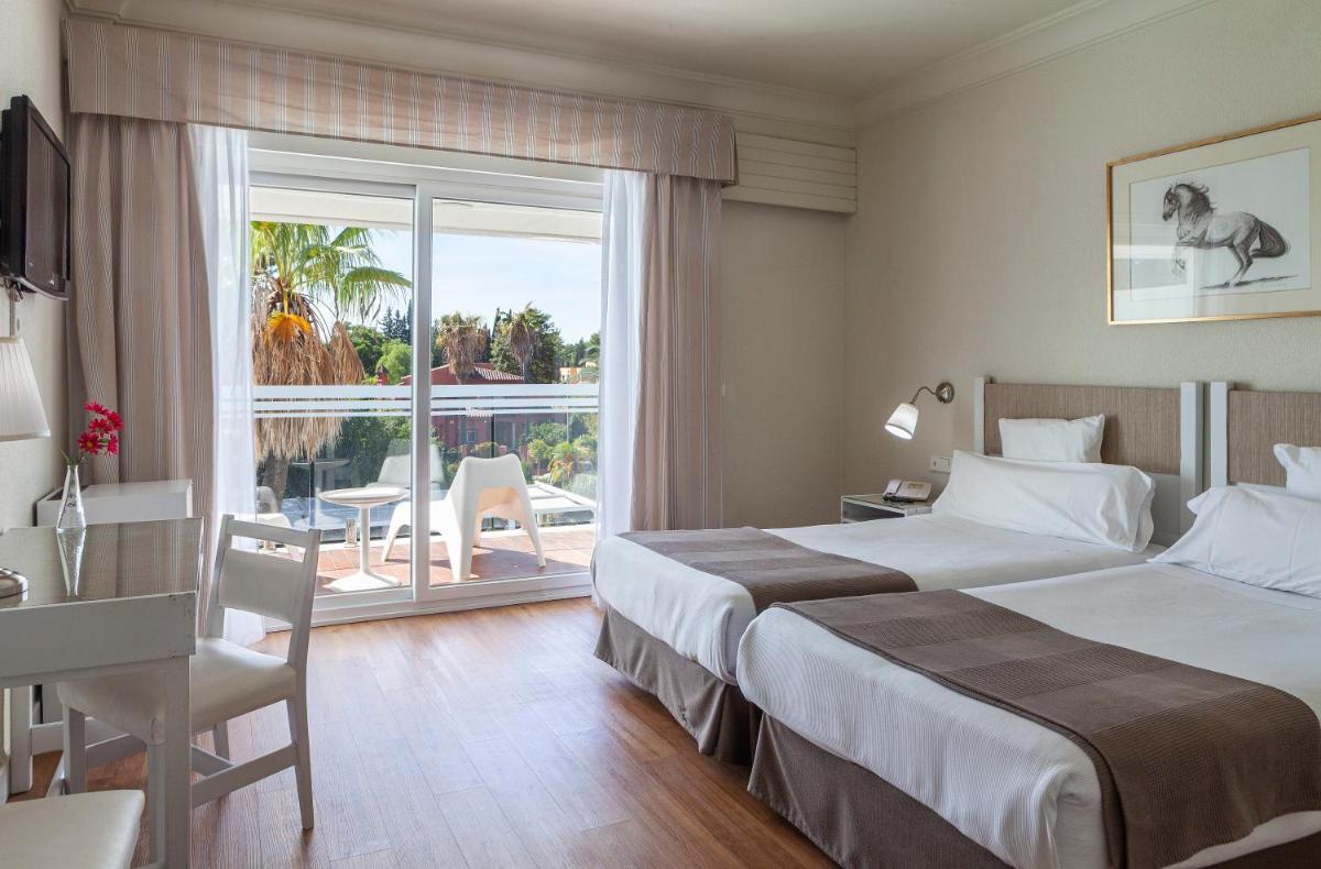 Cama o camas de una habitación en Hotel Jerez & Spa