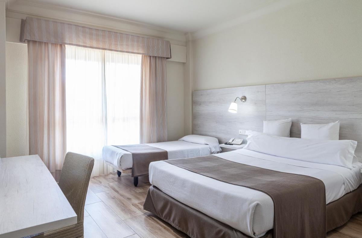 Cama o camas de una habitación en Hotel Jerez & Spa